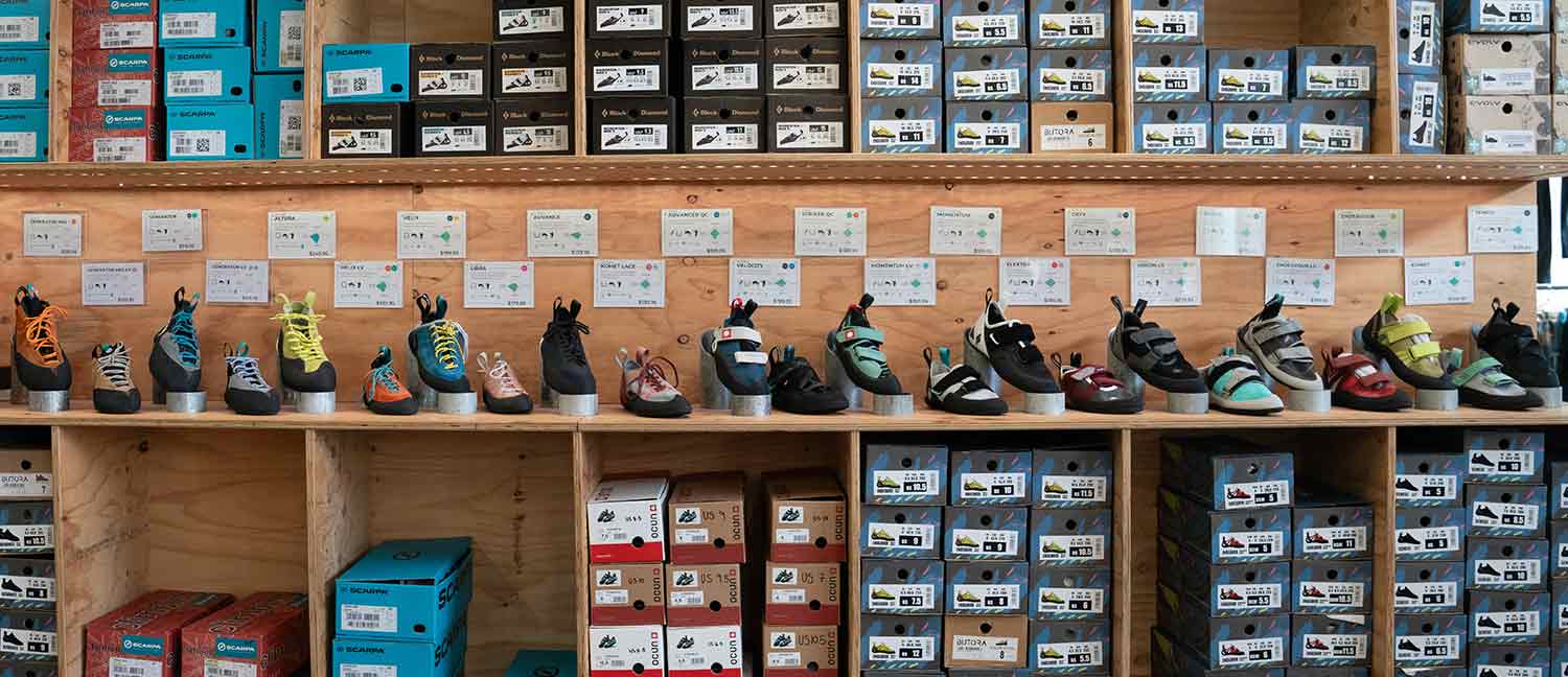 Wall of climbing shoes in store